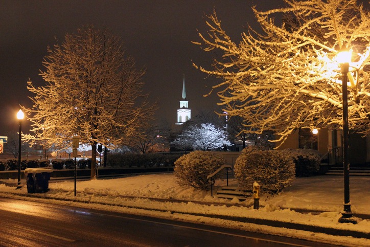 In the early morning after a hard snowfall, this is a shot of the Calvary Baptist Church steeple in downtown Lexington, Kentucky. The lightposts are tinted yellow, the white balance isn't off.